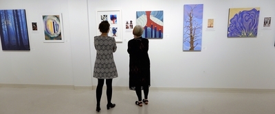 Megan and Judith observe art works